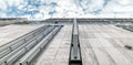 The wall of a modern building towering against the sky