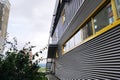 Wall of metal industrial building with windows Royalty Free Stock Photo