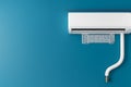 Wall mounted air conditioner installation on blue wall Royalty Free Stock Photo