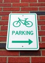 Bicycle Parking Sign Mounted on a Brick Building Royalty Free Stock Photo