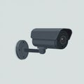 A wall-mounted CCTV security camera features a cylindrical body with a dark gray Royalty Free Stock Photo