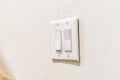 Wall mounted electrical rocker light switch with multiple flat broad levers