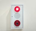 A fire alarm panel in white color with red indicator light a buzzer or speaker and an alarm button Royalty Free Stock Photo