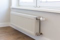 Wall mounted heating radiator with thermostat. Battery.