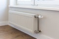 Wall mounted heating radiator with thermostat. Battery.