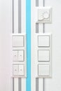 Wall mounted light switches, roller shutter control switch for closing windows, electrical outlet and temperature Royalty Free Stock Photo