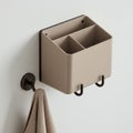 Wall-mounted organizer with a minimalist design, featuring three compartments in a Royalty Free Stock Photo