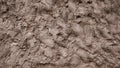 A wall of mud, cement putty decorative background, a mixture of earth smeared on the ground, a pattern of clay on the