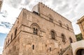 Wall with Mullioned windows with lava stone inlays of the Palace Steri Chiaramonte, Palermo, Sicily, Italy Royalty Free Stock Photo