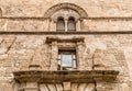 Wall with Mullioned windows with lava stone inlays of the Palace Steri Chiaramonte, Palermo, Sicily, Italy Royalty Free Stock Photo