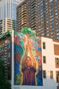 Wall mural of child holding tree in Philadelphia, Pennsylvania