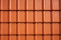 Wall with new red roof tiles in bright sunlight, texture, background, pattern Royalty Free Stock Photo