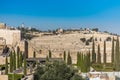 Wall of Old City of Jerusalem with background of Jewish graveyard at the Mount of Olives near the Kidron Valley or King`s Valley Royalty Free Stock Photo