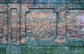 A wall of old, damaged red brick. Scratches and cracks. The background and texture of an antique retro brick Royalty Free Stock Photo