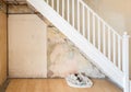 Old bare wall and staircase before being plastered.