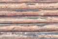Wall of old logs. Horizontal arrangement. Close-up