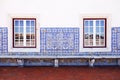 Wall with old Portuguese tiles and windows