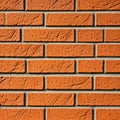 Wall of old red bricks in a pattern with a bevel Royalty Free Stock Photo