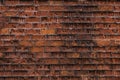 Wall of old red clay bricks. Ruined vintage stone background. Rough aged masonry backdrop. Surface of grunge brick Royalty Free Stock Photo