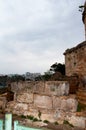 The wall of the old tower. The brick collapsed the fence. Antalya, Turkey, April 6, 2019