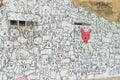 Wall of old vintage house with simple cat and dog graffiti