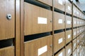 Wall of old wooden postal mailboxes and lockers in perspective v Royalty Free Stock Photo