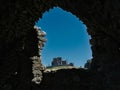 A wall opening with a view of the Rock of Cashel Royalty Free Stock Photo