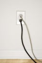 Wall outlet with plugs. Royalty Free Stock Photo