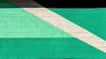 A wall painted with alternating stripes of green and white. Royalty Free Stock Photo