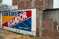 Wall painted billboard for local barteries. at Manta, Ecuador