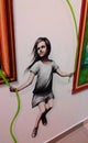 On the wall is a painted figure of a girl jumping rope Royalty Free Stock Photo