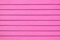 Wall panel paint pink color synthetic wooden plank texture surface background.Outdoor panel engineered wood nature pattern or abst