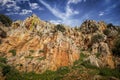 Wall of peculiar colorful rock in the Estrecho del Hocino micro-nature reserve in Salobre Royalty Free Stock Photo