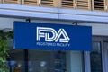 Wall of Pharma company showing on REctangle sign light board l FDA Registered Facility. approved