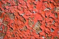 Wall with pieces of red plaster