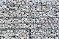 Wall of pile of stones in a grillage Royalty Free Stock Photo