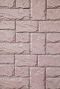 Wall from a pink brick of a stone with a regular laying Royalty Free Stock Photo