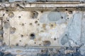 Wall plaster texture with bullet holes