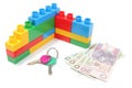 Wall of plastic colorful building blocks with home keys and money Royalty Free Stock Photo