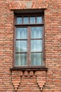 Wall of red bricks with window Royalty Free Stock Photo