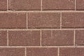 Wall of red granite bricks Royalty Free Stock Photo