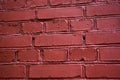 The wall of red-painted brick building in the city Royalty Free Stock Photo