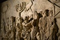 Wall relief on arch of titus depicting Menorah taken from temple in Jerusalem in 70 AD - Israel history, Jewish war