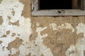 The wall of a residential old house built with bricks made from mud, cow dung and straw. Peeling plaster. Serbia Royalty Free Stock Photo