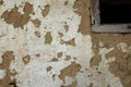 The wall of a residential old house built with bricks made from mud, cow dung and straw. Peeling plaster. Serbia Royalty Free Stock Photo