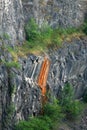 A wall of rock at the quarry. Royalty Free Stock Photo