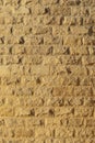 Wall with rough brickwork. Masonry of yellow sand brick blocks. Royalty Free Stock Photo
