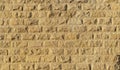 Wall with rough brickwork. Masonry of yellow sand brick blocks. Royalty Free Stock Photo