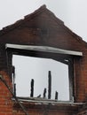 Wall of a ruined of a burned down residential building after a fire