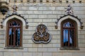 A wall sculpture illustrating shields and worrier helmet, Sturdza castle, Miclauseni, Romania